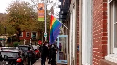 View of a rainbow flag on Front Street, beside Roost & Company
