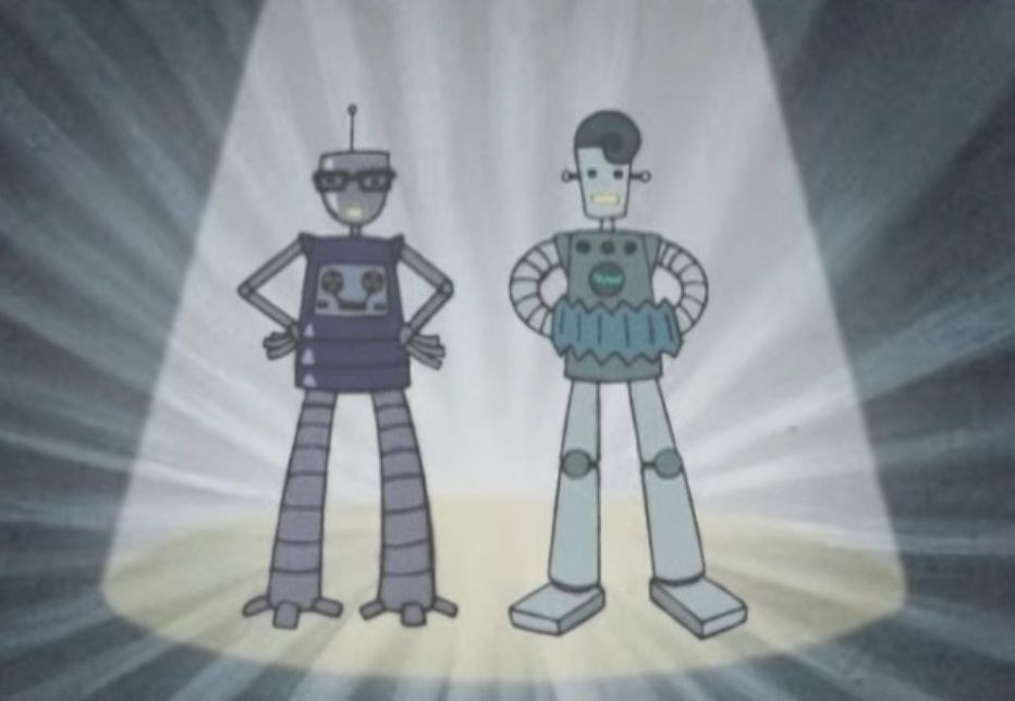 Two robots. One has dark glasses and an antenna. The other has an accordion and floppy hair.
